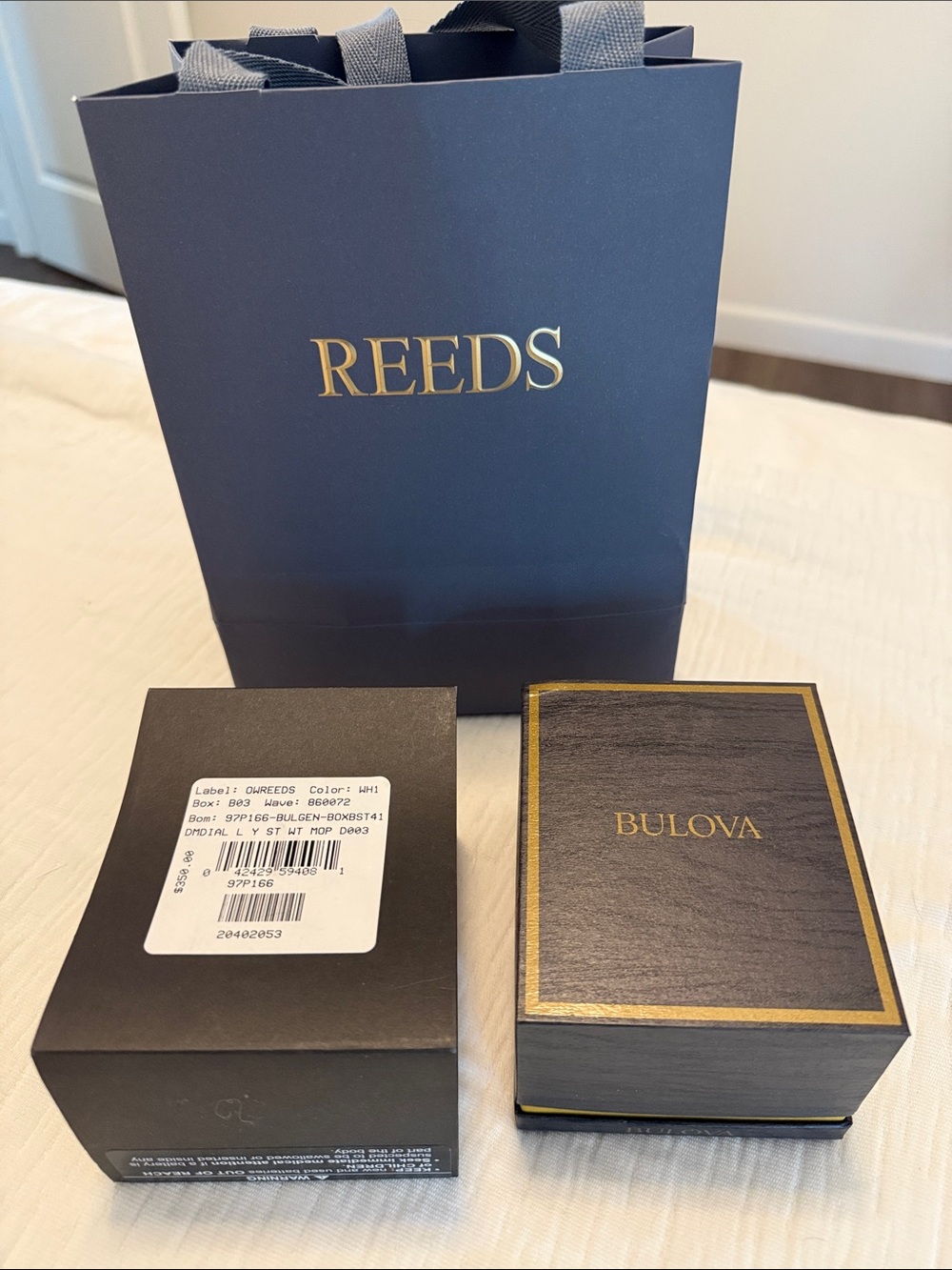 Bulova Black and Gold Rectangular Watch in Presentation Box